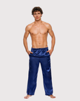 Man wearing the Luné d’Or Men’s Satin Lounge Pant in navy, front view showing the elastic waistband and wide straight leg.