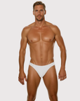 Man wearing the Luné d’Or Forme Men’s Thong in gray, front view showing the contoured pouch and slim waistband.