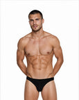 Man wearing the Luné d’Or Ligne Men’s Jockstrap in black, front view showing the smooth matte finish and sculpted contour pouch.
