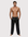 Man wearing the Luné d’Or Men’s Satin Lounge Pant in black, front view showing the elastic waistband and wide straight leg.