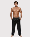 Man wearing the Luné d’Or Men’s Satin Lounge Pant in black, front view showing the elastic waistband and wide straight leg.