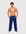 Man wearing the Luné d’Or Men’s Satin Lounge Pant in navy, front view showing the elastic waistband and wide straight leg.