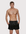 Man wearing the Luné d’Or Men’s Satin Lounge Short in black, front view showing the elastic waistband and side pockets.