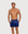 Man wearing the Luné d’Or Men’s Satin Lounge Short in navy, front view showing the elastic waistband and side pockets.