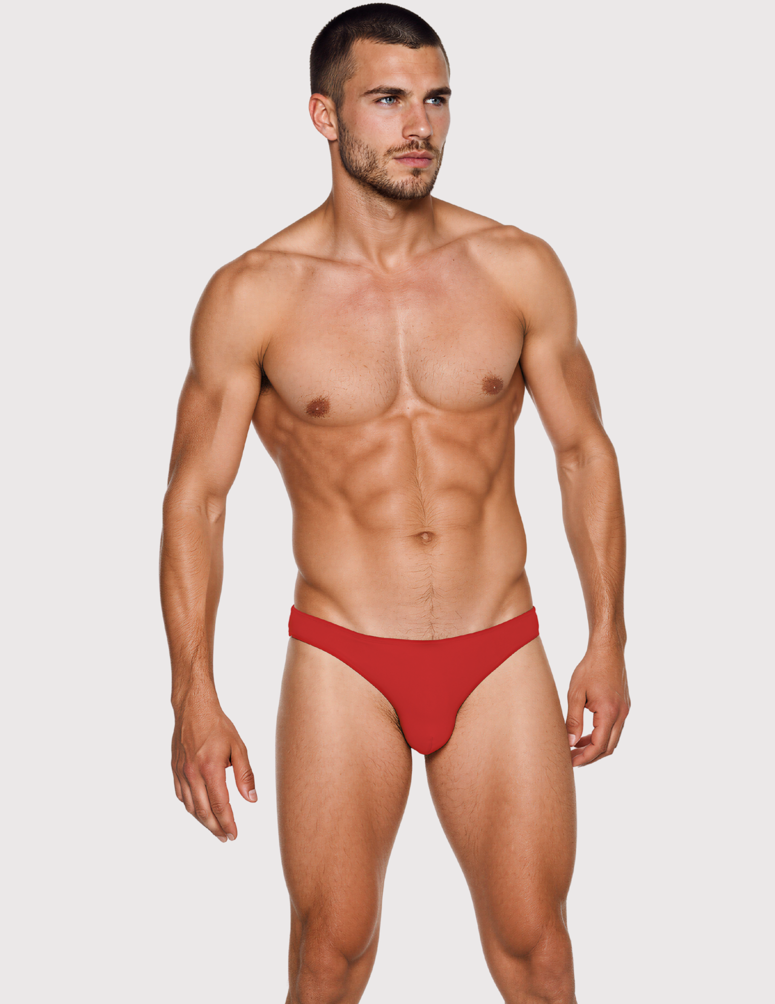 Man wearing the Luné d’Or Ligne Men’s Jockstrap in red, front view showing the contoured pouch and wide waistband.