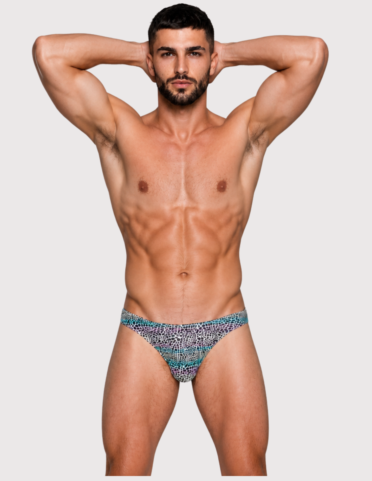 Man wearing the Luné d’Or Mirage Men’s Jockstrap in iridescent leopard, front view showing the printed contour pouch.