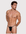 Man wearing the Luné d’Or Fil Men’s G-String in black, front view showing the minimal contour pouch and thin waistband.