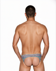 Back view of the Luné d’Or Mirage Men’s Jockstrap in iridescent leopard print, showing the open jockstrap back with elastic leg straps.