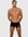 Man wearing the Luné d’Or L’Essentiel Men’s Sculpted Short in black, front view showing the high shine sculpted fit.