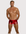 Man wearing the Luné d’Or L’Essentiel Men’s Sculpted Short in red, front view showing the high shine sculpted fit.
