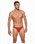 Man wearing the Luné d’Or Ligne Men’s Jockstrap in red, front view showing the smooth matte finish and sculpted contour pouch.