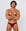 Man wearing the Luné d’Or Éclat Men’s Jockstrap in metallic red, front view showing the high shine contoured pouch.