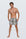 Man wearing the Luné d’Or Men’s Satin Lounge Short in snake print, front view showing the elastic waistband and relaxed leg.