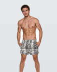 Man wearing the Luné d’Or Men’s Satin Lounge Short in snake print, front view showing the elastic waistband and relaxed leg.